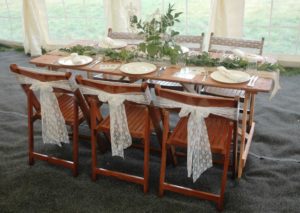 Rustic tables and wooden folding chairs